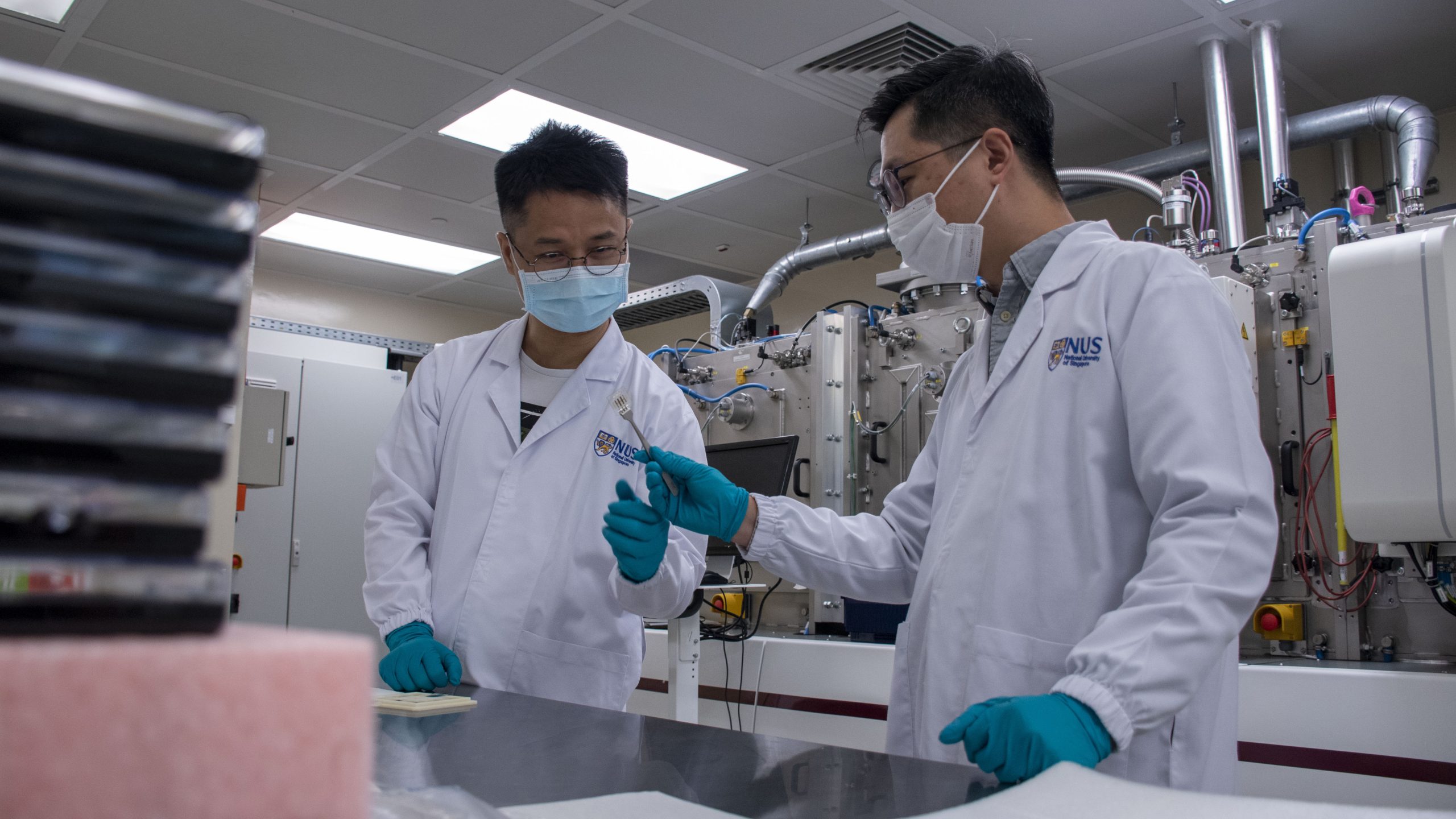 Asst Prof Hou Yi (right), Dr Chen Wei (left) and their team have developed perovskite/organic tandem solar cells that achieved a power conversion efficiency of 23.6%. 