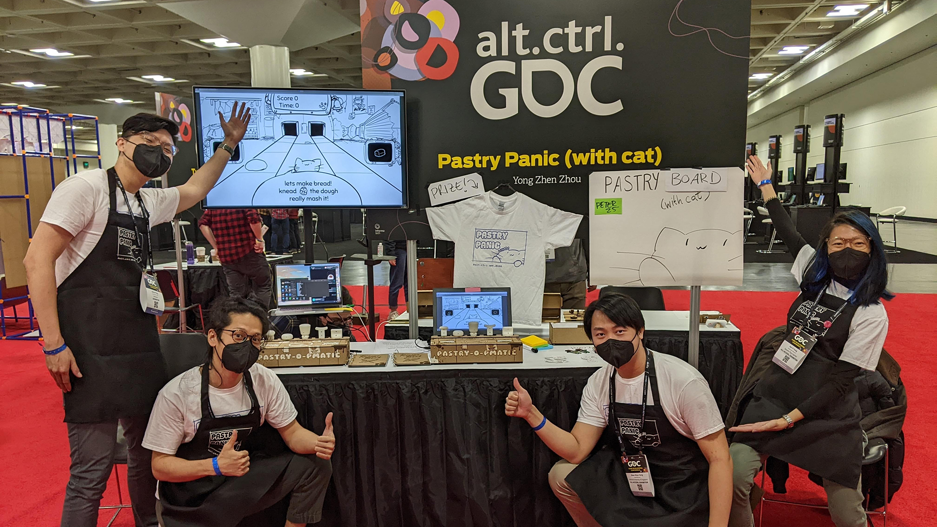 Industrial Design student Yong Zhen Zhou (front right, crouching) at the Pastry Panic exhibit stand in San Francisco.