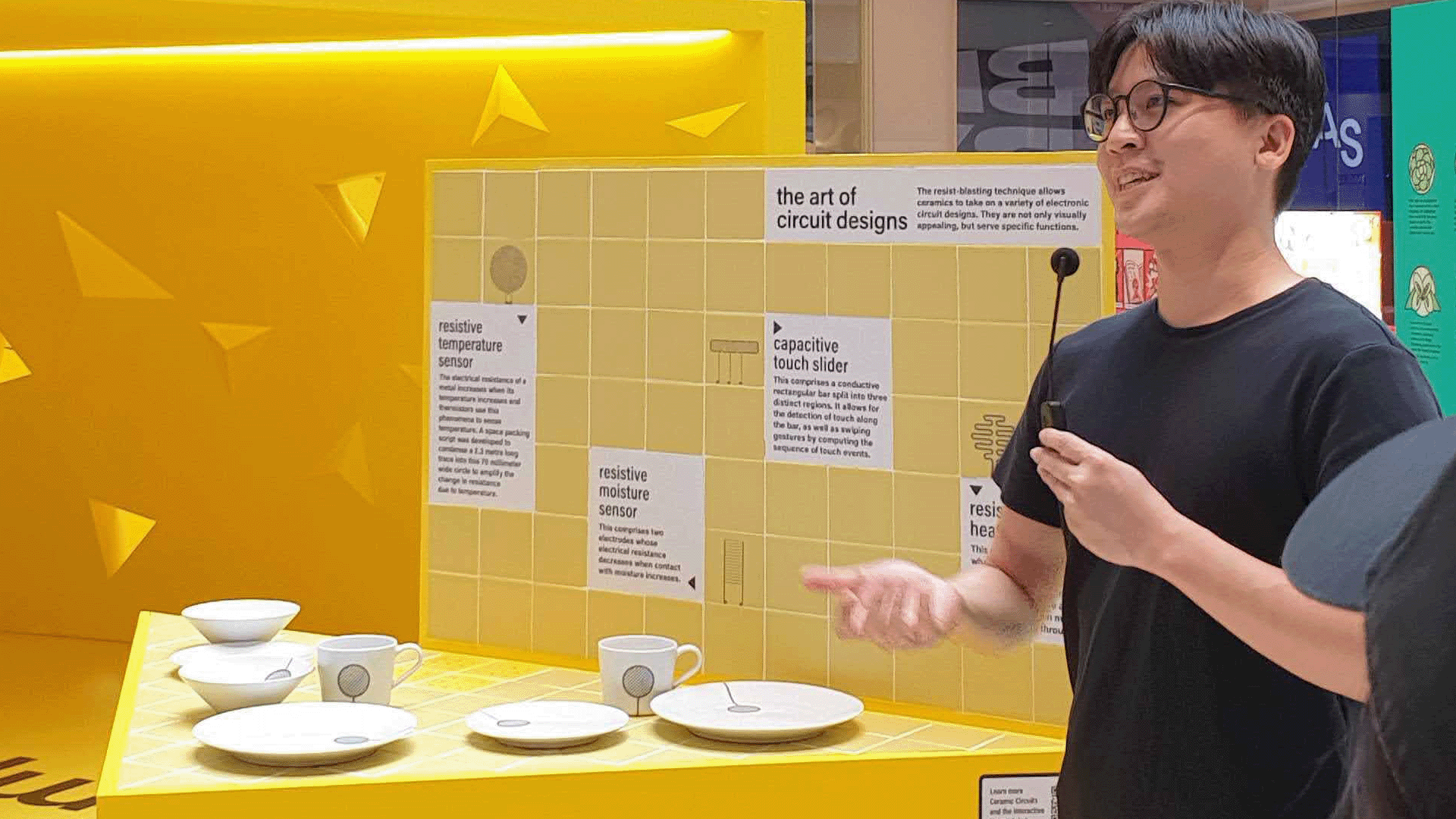 Asst Prof Clement Zheng introduces an exhibit on Ceramic Circuits at the National Design Centre in Singapore.