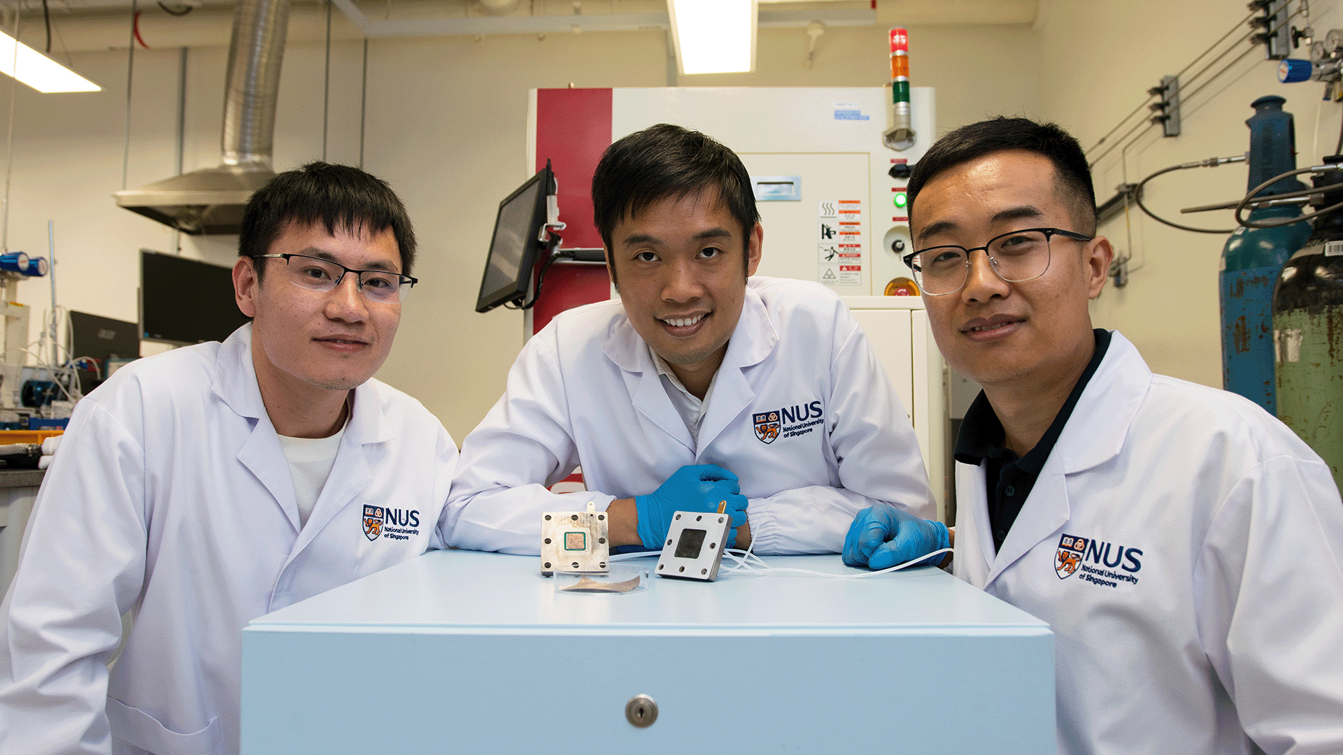 Asst Prof Lum Yanwei (centre) and his team Mr Wang Meng (right) and Dr Wang Bingqing (left) say their new technique offers a cost-effective way to convert waste carbon emissions.