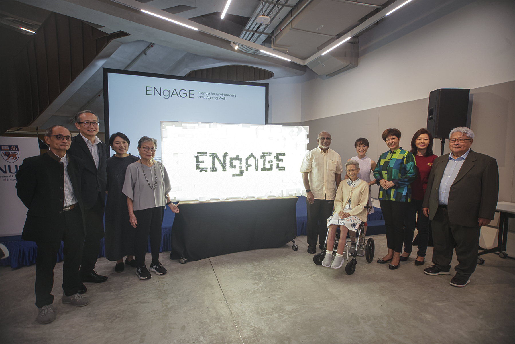 The Centre for Environment and Ageing Well (ENgAGE), a research centre at NUS College of Design and Engineering, was launched by Ms Indranee Rajah, Minister, Prime Minister’s Office, and Second Minister for Finance and National Development (third from the right). She was accompanied by Professor Heng Chye Kiang (second from the left); Associate Professor Emi Kiyota (third from the left); Associate Professor Fung John Chye (first from the left); Mrs Lee Li-ming (fourth from the left); and community members (right).