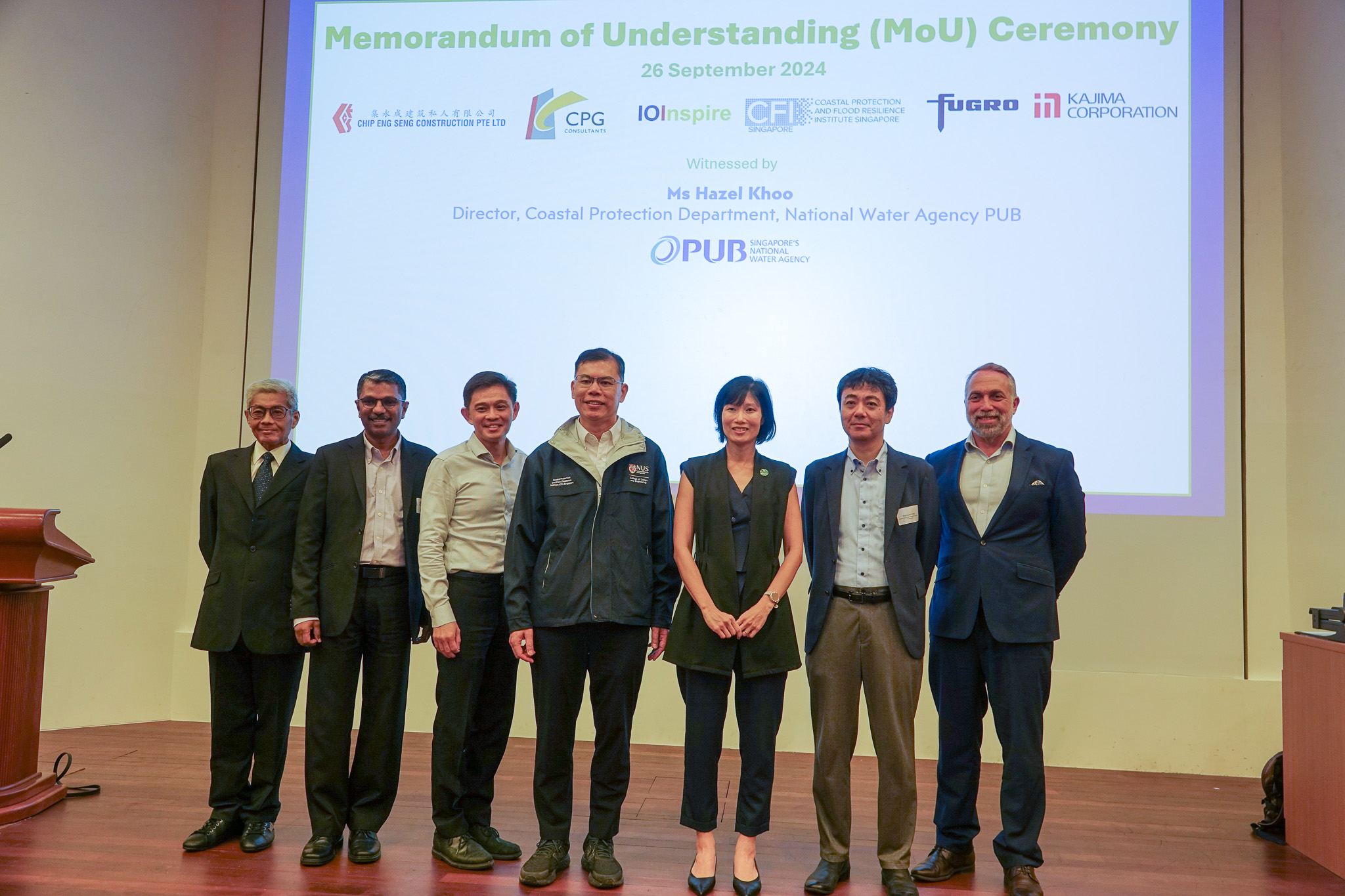 Professor Adrian Law, Executive Director of CFI Singapore, with Ms Hazel Khoo, Coastal Protection Department Director in PUB, at a signing ceremony with five industry partners.