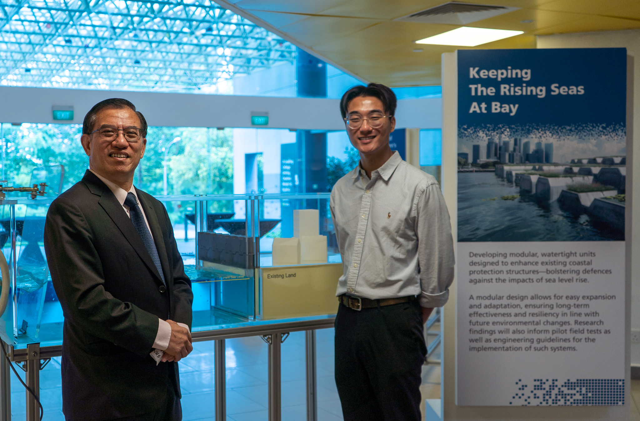 Assistant Prof Chew (left) and Mr Ryan Lee (right) are working on a project to retrofit existing coastal protection structures along Singapore’s coastline. 