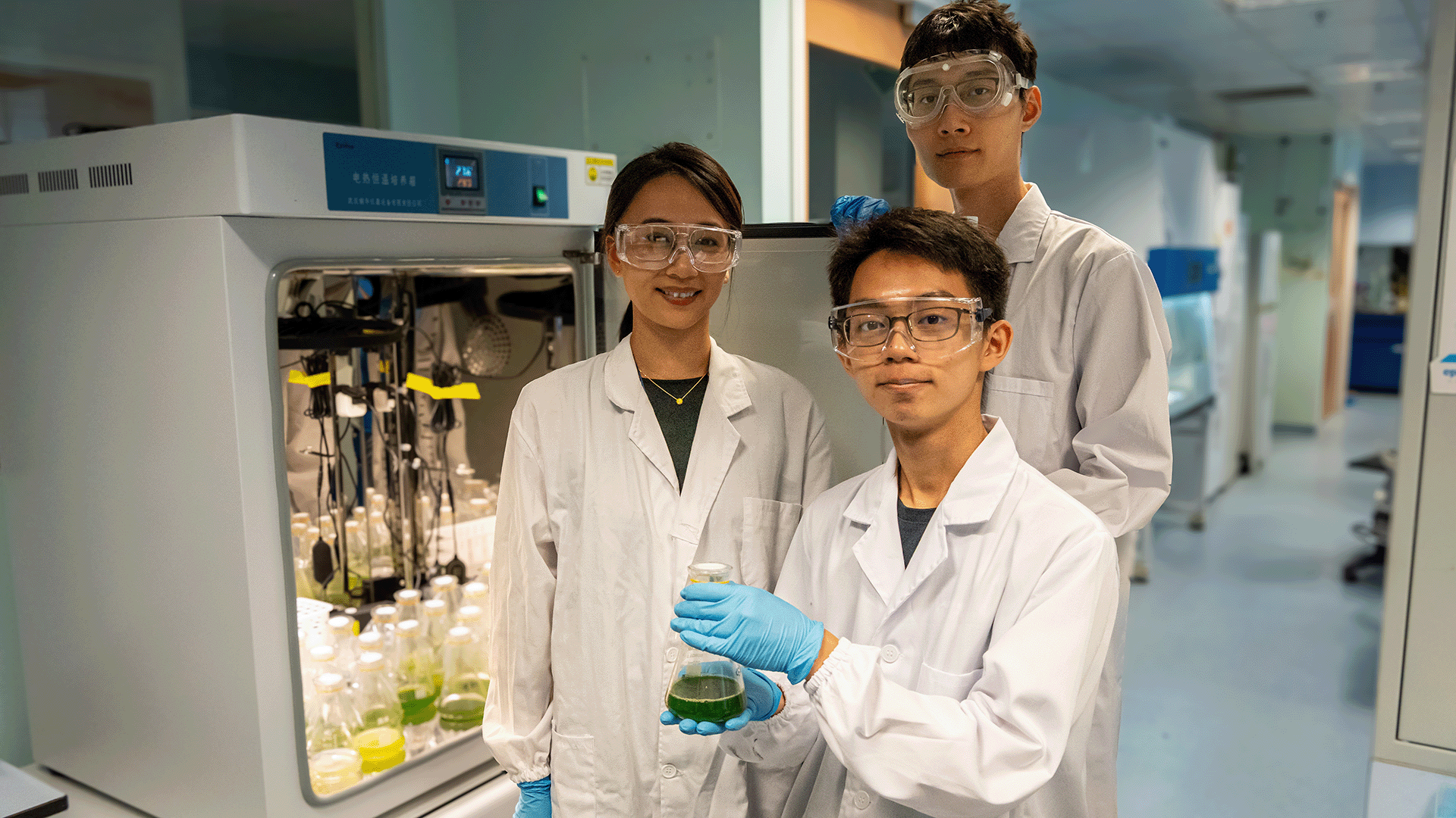 Asst Prof Iris Yu (left) with members of her research team PhD student Li Zhuo (back) and BEng student researcher Chia Min Shen (front).