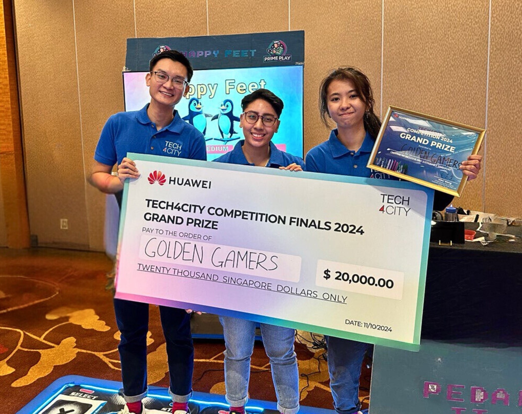 From left to right: Jonathon Leong, Fatin Sharafana and Denise Caluza winning the Tech4City competition.