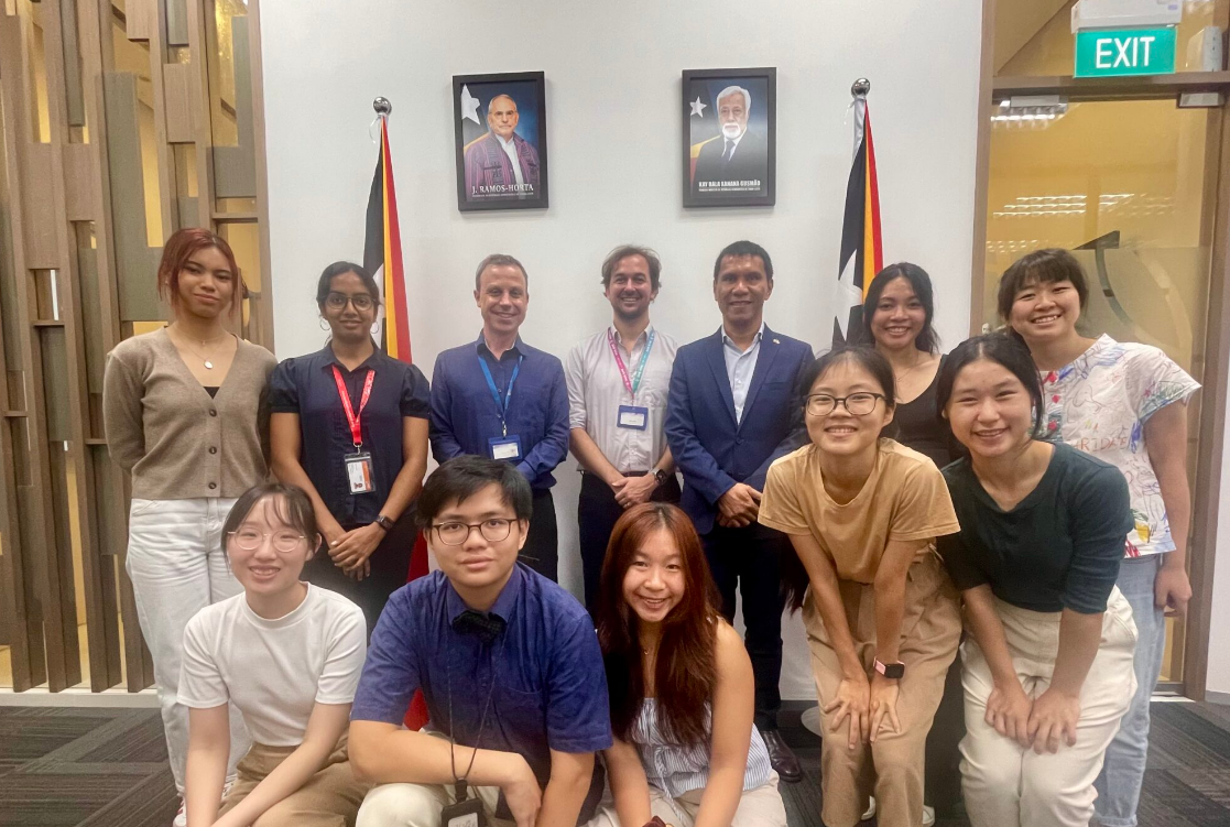 The students shared their experiences in Timor-Leste with Ambassador Alexandre Tilman (back row; third from right) at the Embassy of the Democratic Republic of Timor-Leste.