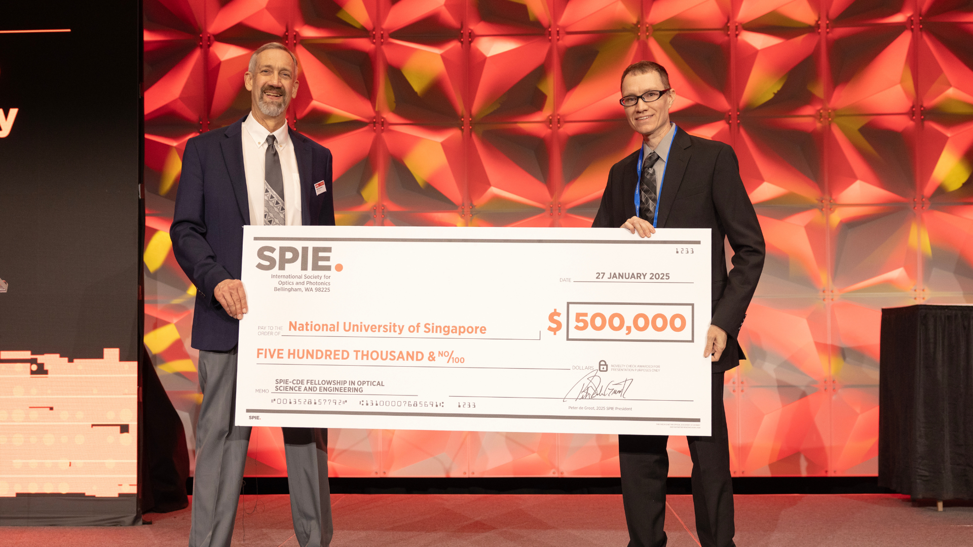 SPIE cde news photo The US$500,000 gift was presented to Assoc Prof Aaron Danner (right) at SPIE Photonics West on 27 January 2025.