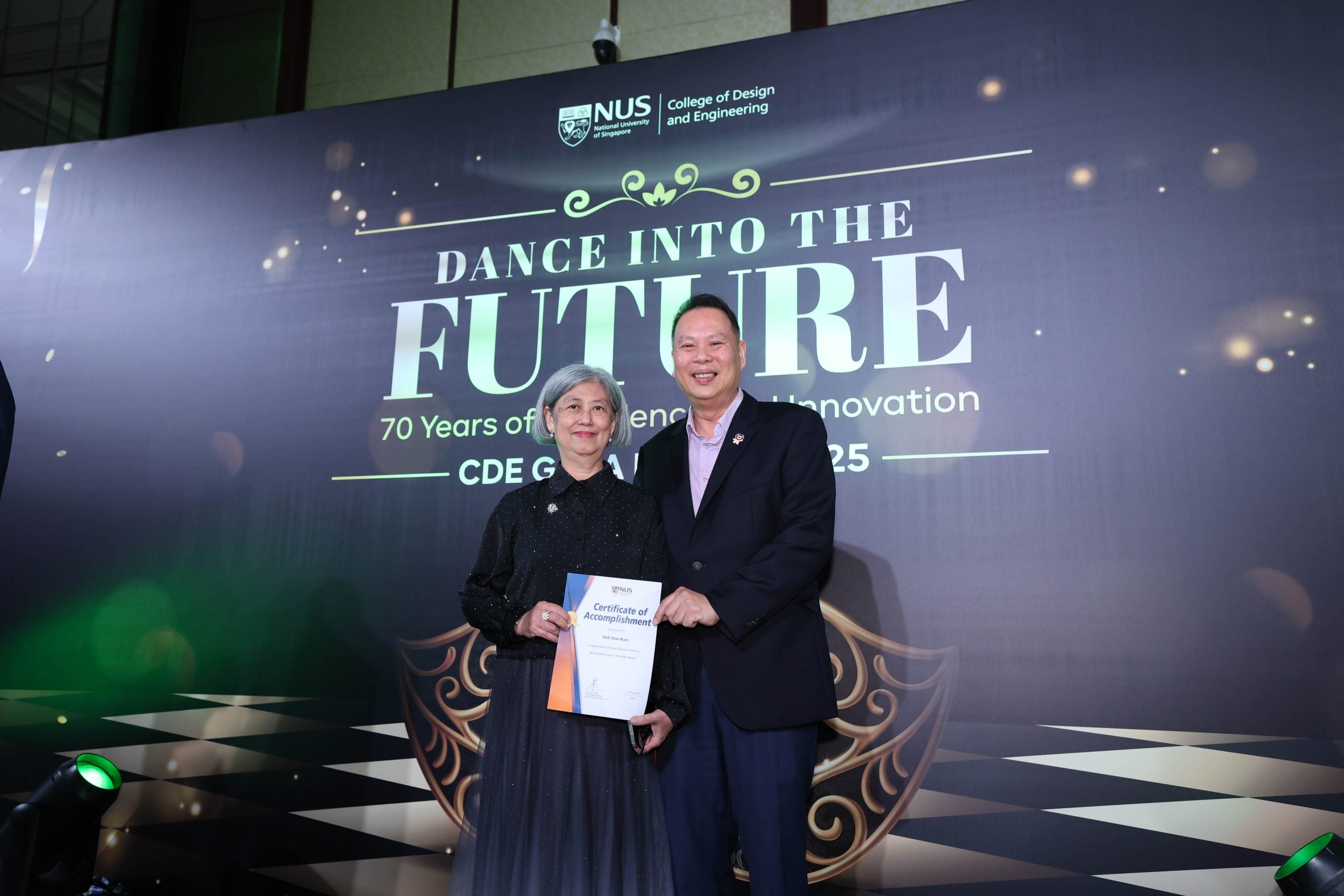 Ms Regina Chin-Hoh receives the CDE long service award