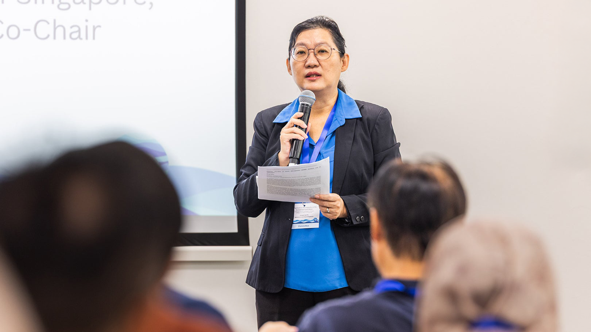 Professor Hu Jiangyong (Civil and Environmental Engineering), co-chair of the symposium, delivering her welcome address.