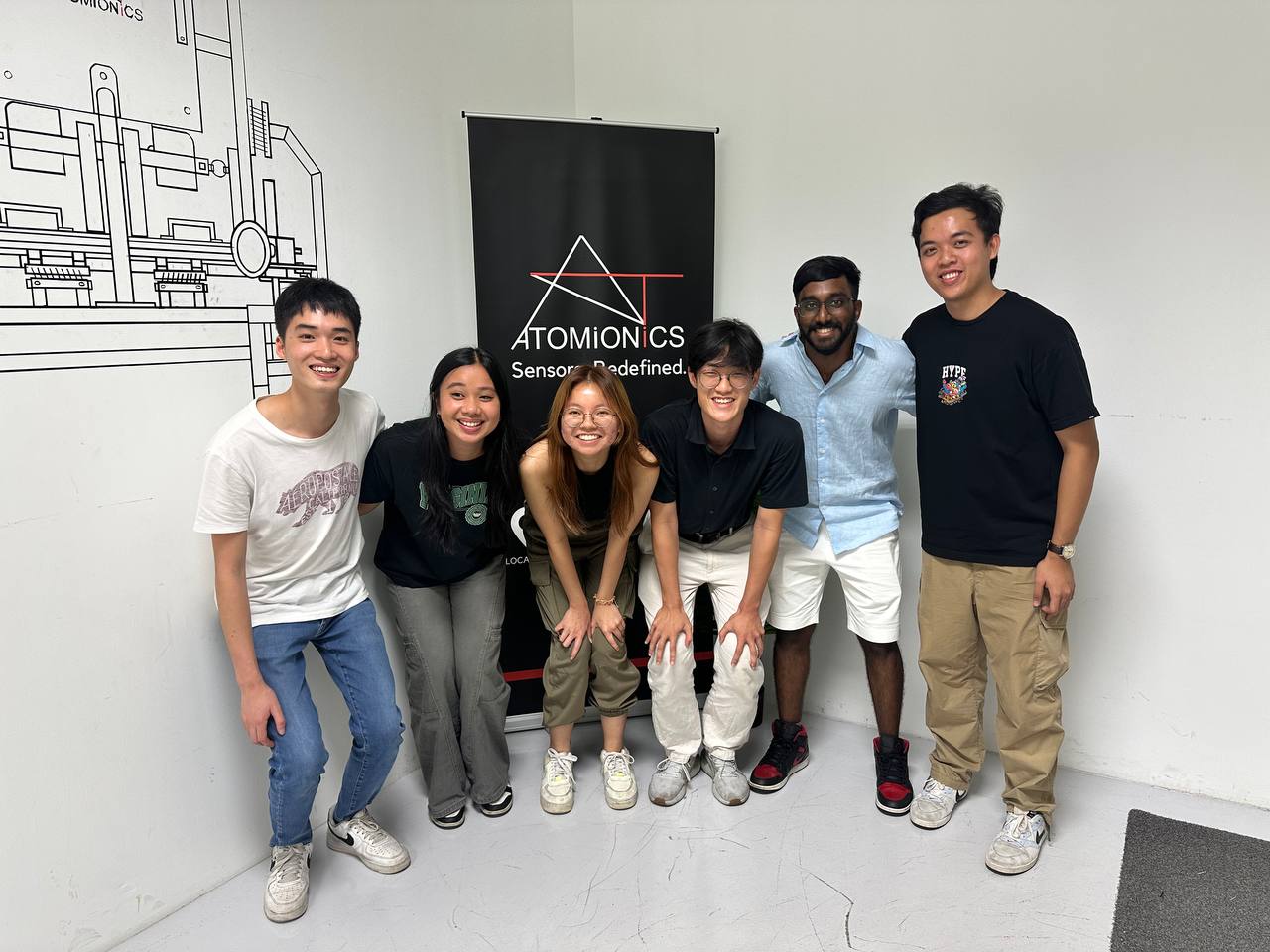 Sangwoo (third from right) with his colleagues from his internship at Atomionics