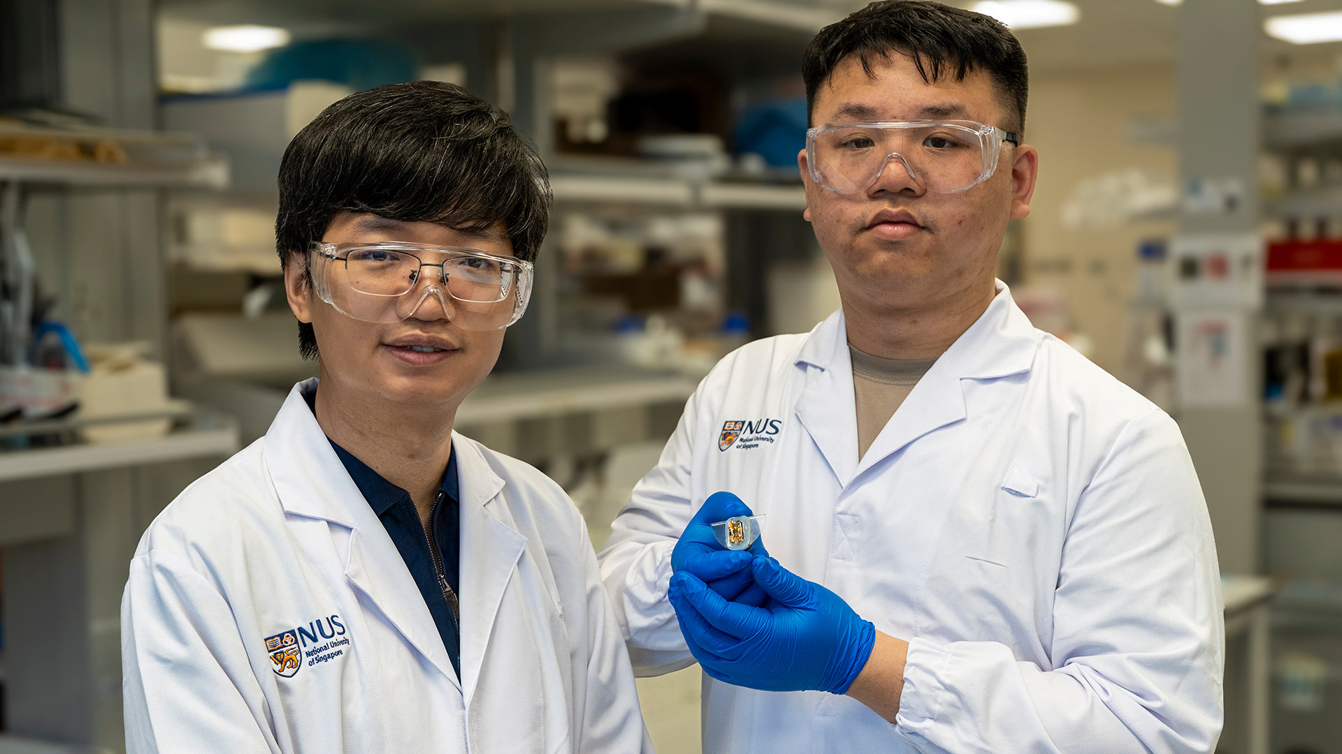 Asst Prof Wu Changsheng (left) and co-first author of the paper, PhD student Xiao Xiao, with a sample of their soft robot.