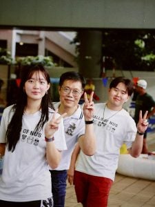 Liu Congzhi with his Hall Master and Sports Director at Inter-Hall Games Opening