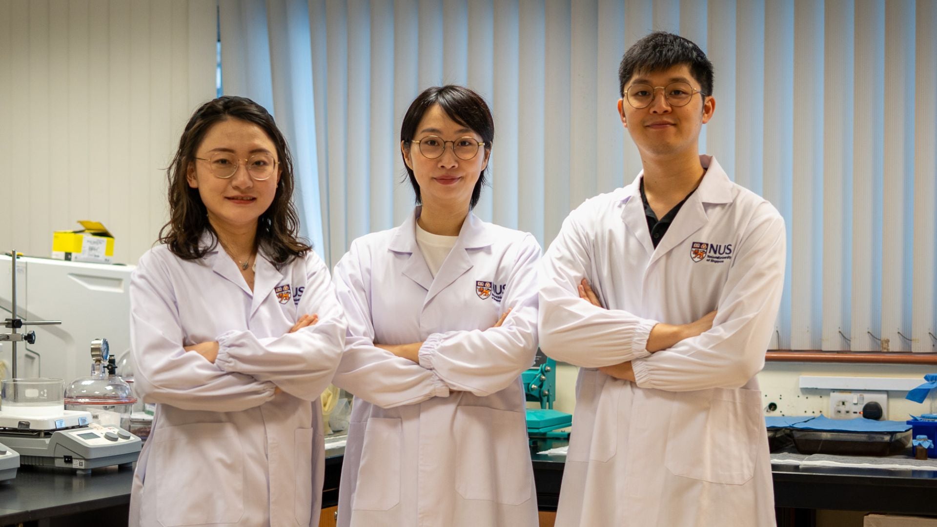 Assistant Professor Tan Yu Jun (centre) with members from her research team, postdoctoral fellow Dr Sun Xiaohu and Dr Eddy Pang. The team developed biodegradable films from kombucha brewing waste for use in sustainable electronics. 