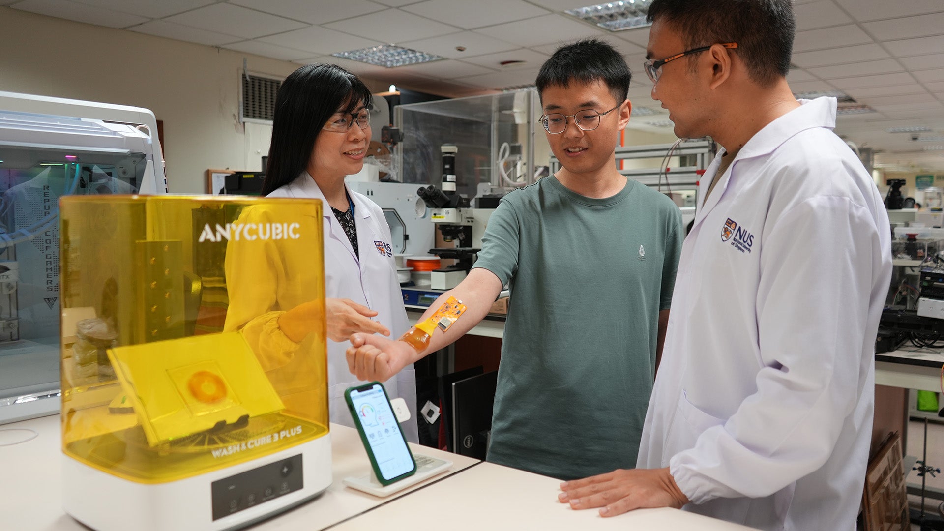 Research team testing AI-powered hydrogel sensor system.