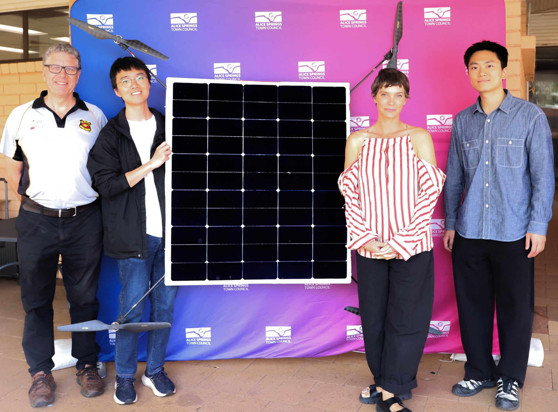 From right to left: Yuan Zifeng, Asta Hill (Mayor of Alice Springs), Zhang Dewen, and Alice Springs resident Matt Skoss who helped support the drone team.