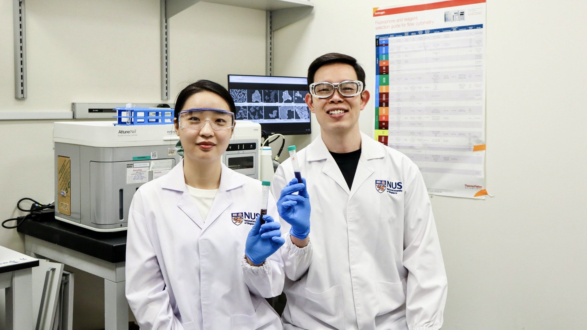 Assistant Professor Andy Tay and researcher in lab.