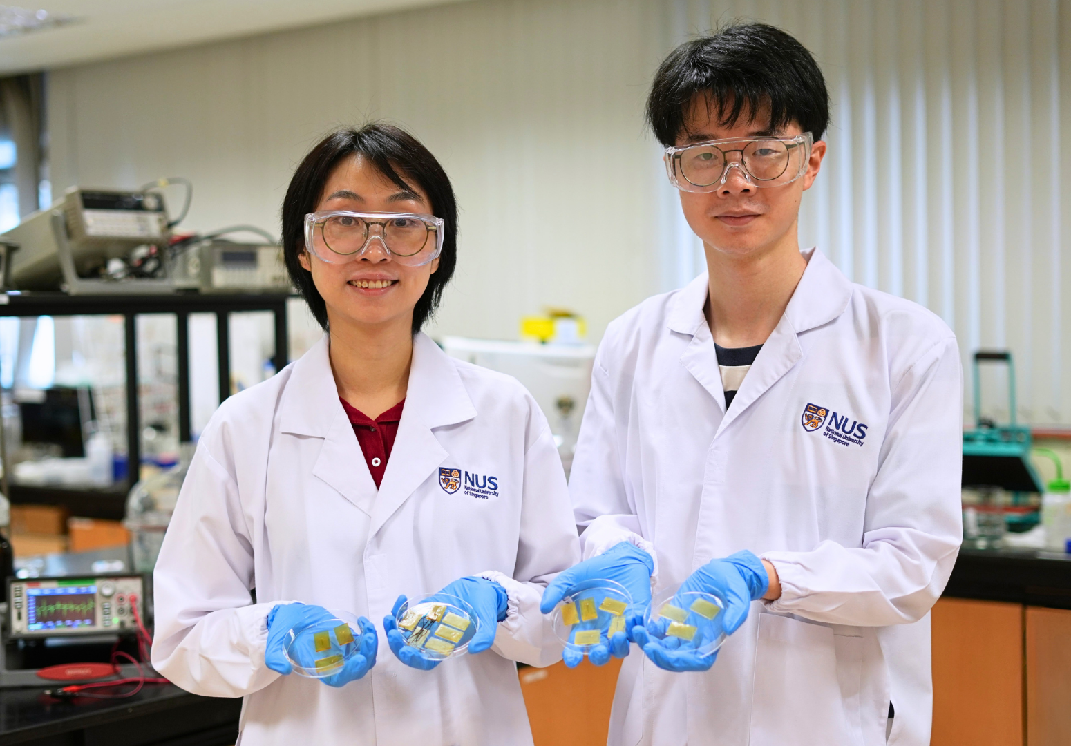 Asst Prof Tan Yu Jun (left), PhD student Mr Zhou Jinrun (right), and their team developed a self-healing electronic skin that can detect touch and damage, repair itself even under water, and enable more durable underwater devices.