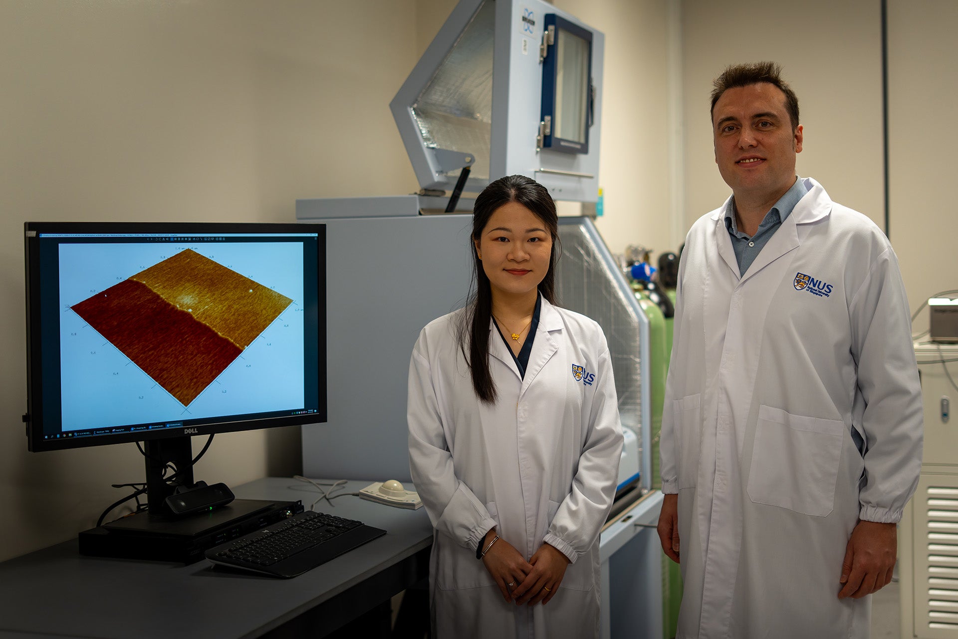 Assoc Prof Mario Lanza (right) with first author of the research, Dr Yue Yuan (left). The researchers’ findings could help guide the development of future electronic components that are smaller, thinner and more energy-efficient. 