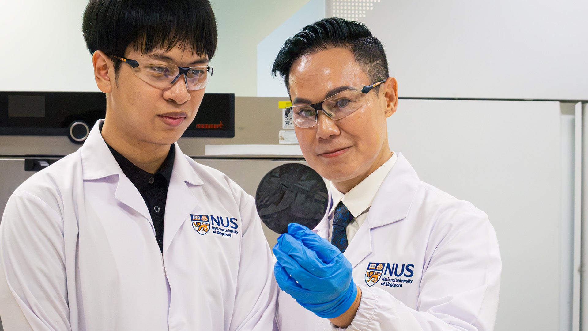 Mr Ngo Minh Quang Phan (left), first author of the study, and Associate Professor Duong Hai Minh, who led the research, with a carbon fibre epoxy aerogel developed by the research team.