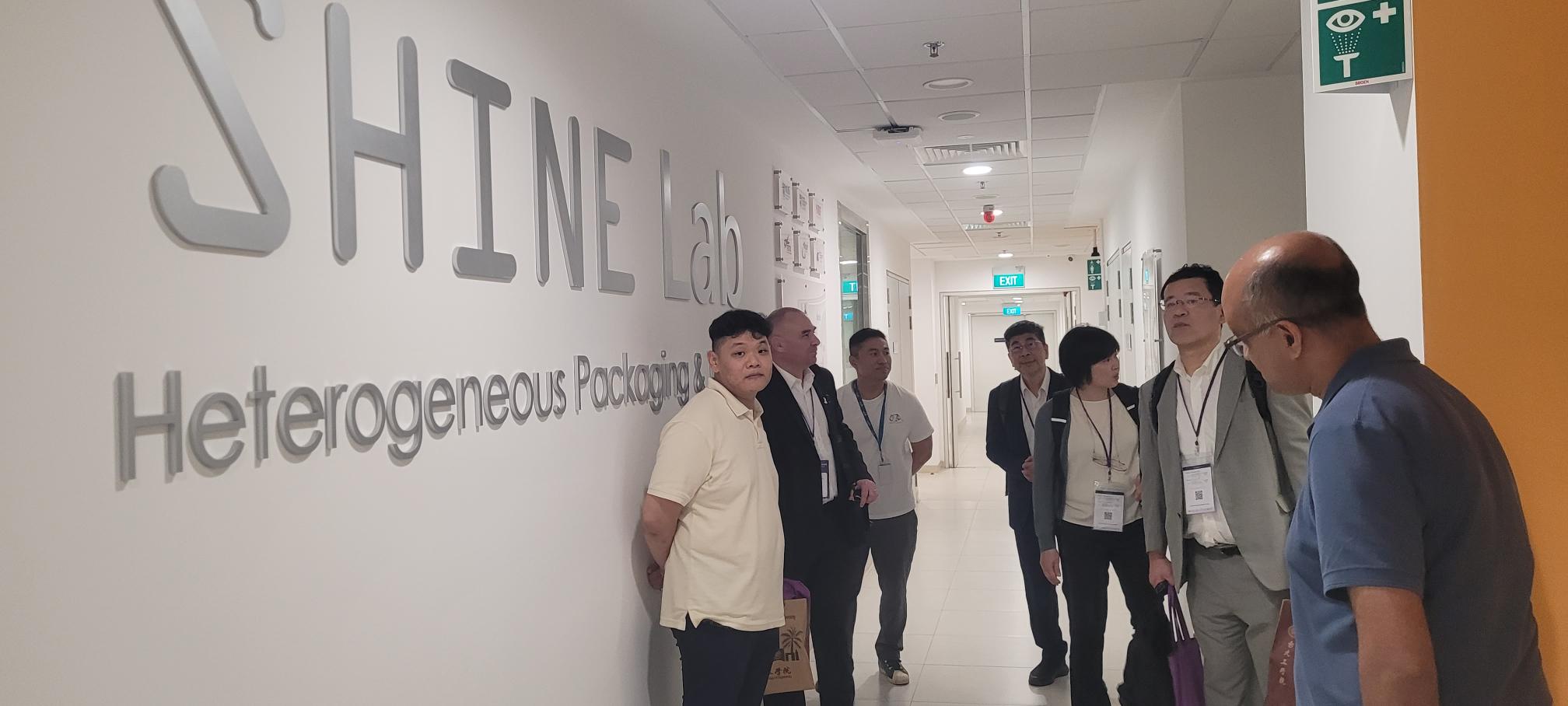 Group Tour outside Level 6 SHINE Lab with SHINE signage -1000029954