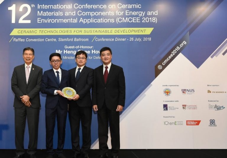 Mr Low Jin Huat (second left) and Dr Guo Jin (second right) received the award from Mr Heng Chee How.