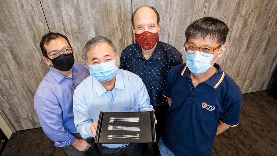 <div>Professor Freddy Boey (centre, showing the swabs), and (from left) Dr Alfred Chia, Associate Professor David Allen, and Associate Professor Yen Ching-Chiuan are part of two NUS teams that</div><div>developed three nasopharyngeal swab designs for COVID-19 testing.</div>