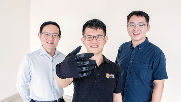 <div>Developed by Professor Lim Chwee Teck (left) and his team, Dr Yeo Joo Chuan (centre) and Dr Yu Longteng (right), microsensors embedded in the InfinityGlove™ allow users to mimic a variety of</div><div>in-game controls using simple gestures.</div>