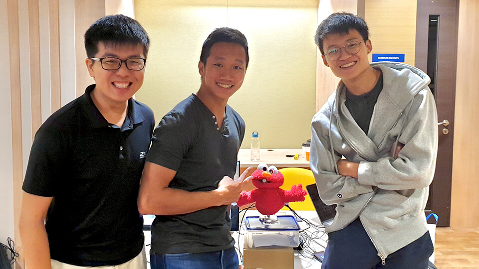 <div>From left: Year 2 students Justin Peh from NUS Science, Sing Hui from NUS Engineering and Lum Wei Boon from NUS Computing created the emotion-detecting video journalling toy with another</div><div>teammate, Yap Zuo Ming from NUS Engineering</div>