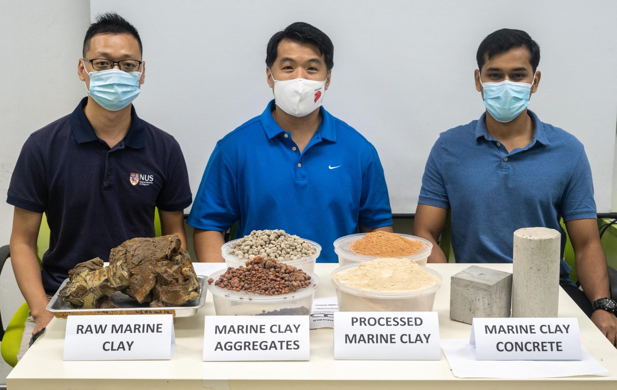 From left: Dr Du Hongjian, Assoc Prof Pang Sze Dai, and Mr Anjaneya Dixit with the raw materials, processed clays, and finished concrete