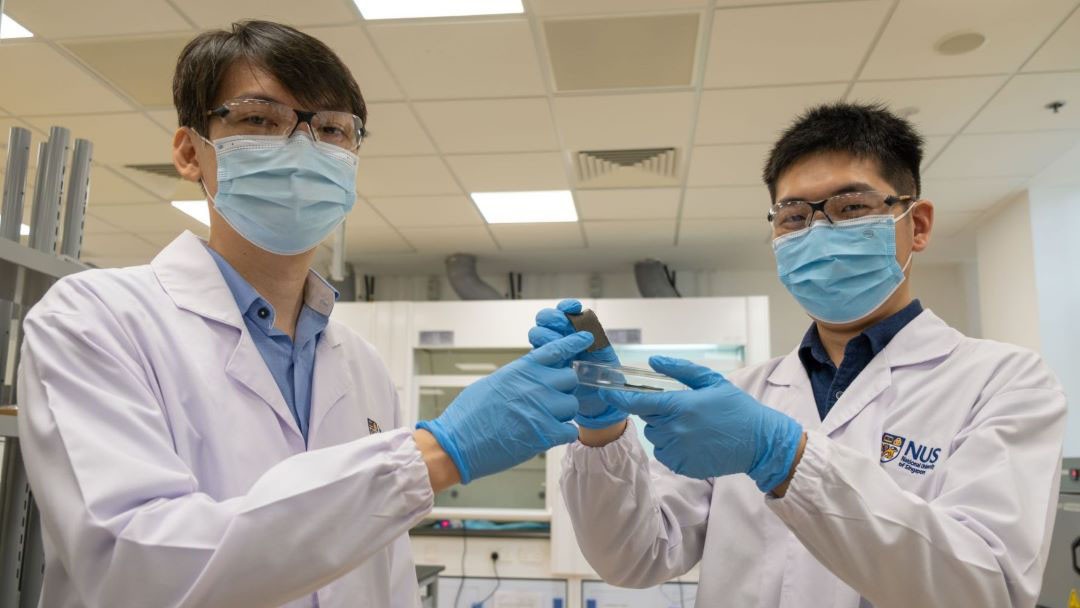 AiFoam was created by a team led by Asst Prof Benjamin Tee (left). Mr Guo Hongchen (right), a member of the research team, is holding a sample of the smart foam