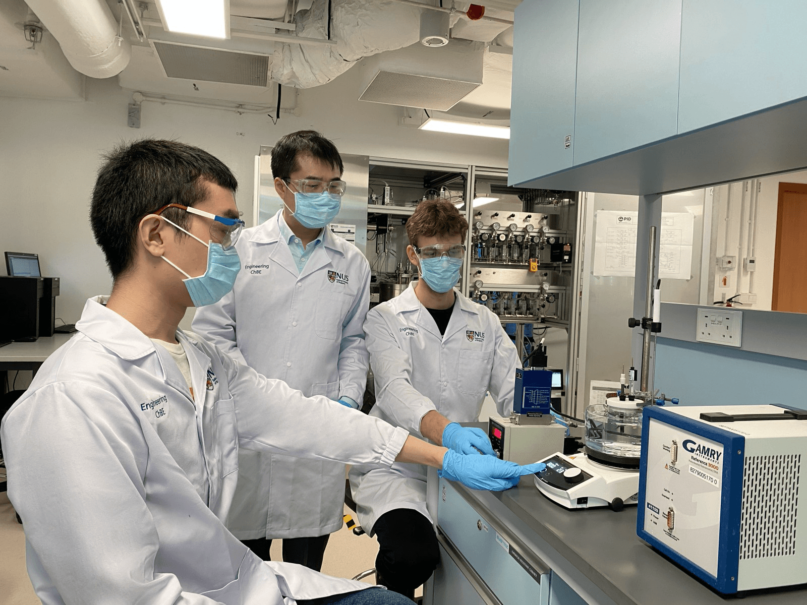 The NUS research team led by Assoc Prof Yan Ning (middle) with doctoral student Mr Lim Chia Wei (left), and Research Fellow Dr Max Hulsey (right).