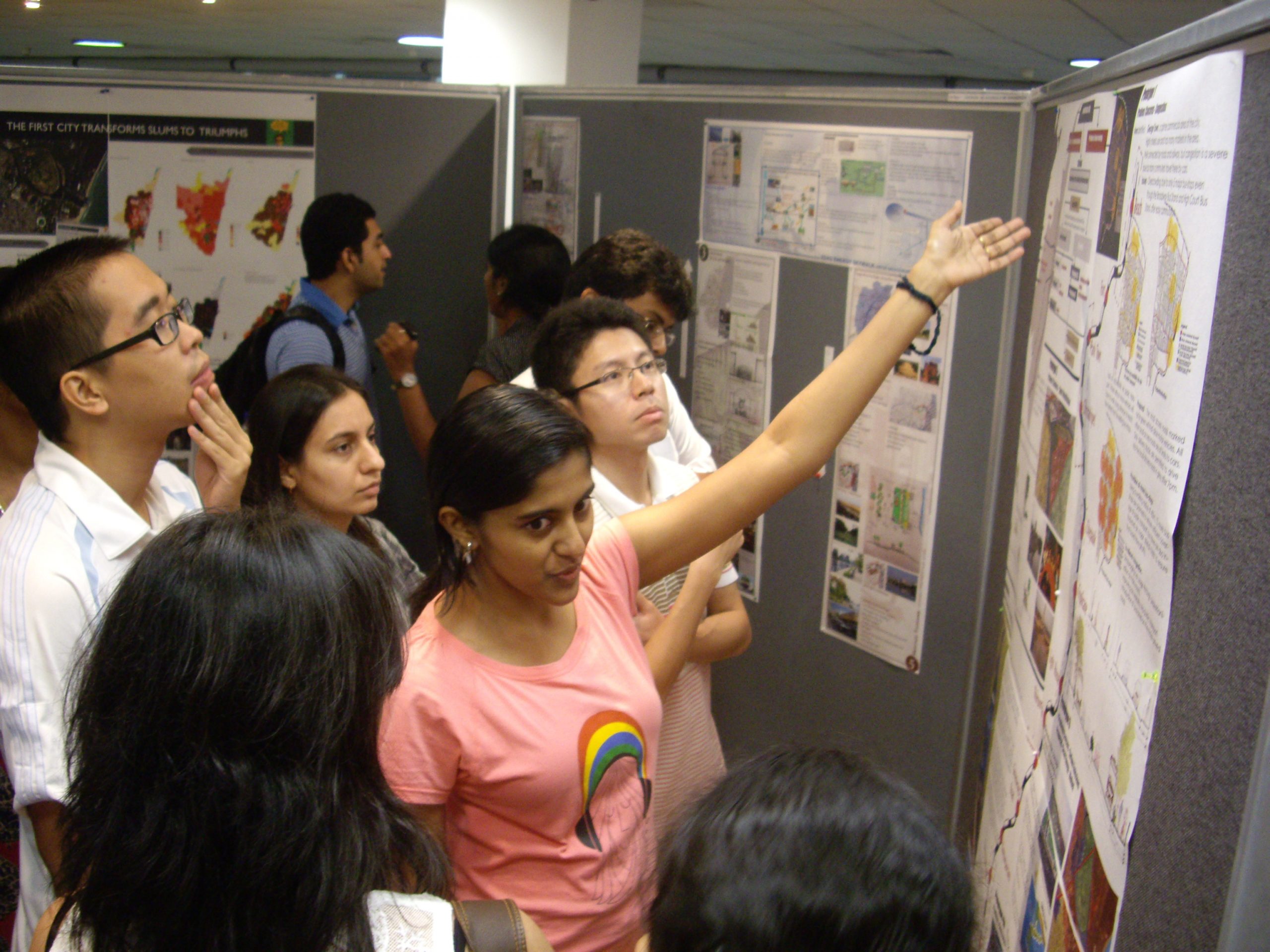 MSc (ISD) students, presenting their projects in class, as part of the programme’s unique studio learning.  (Photo taken before the pandemic)