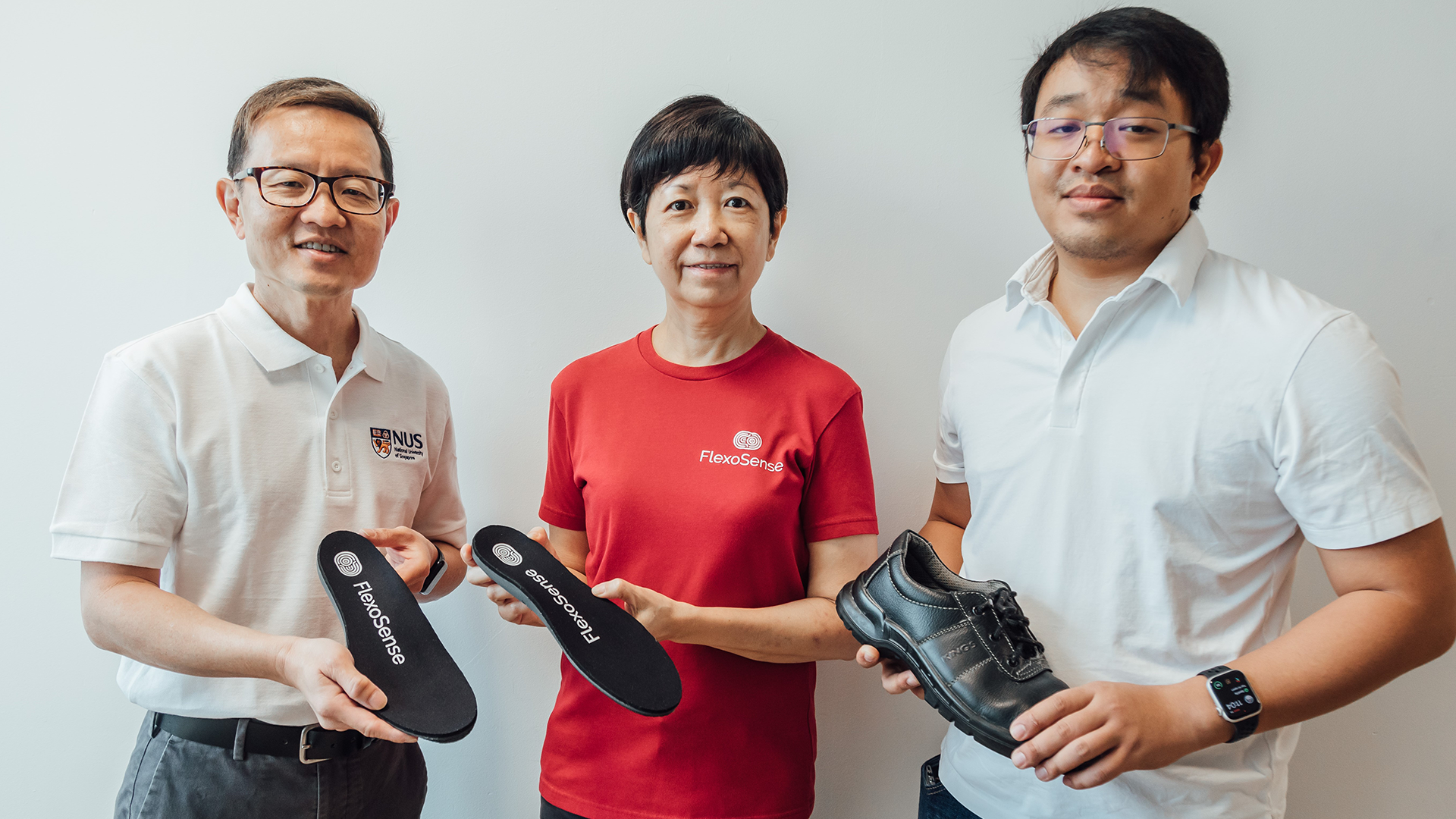 The research team behind the smart insole: Prof Lim Chwee Teck from NUS (left), with Ms Chia Lye Peng (centre), and Mr Mark Francis De Leon (right) from NUS start-up, FlexoSense.