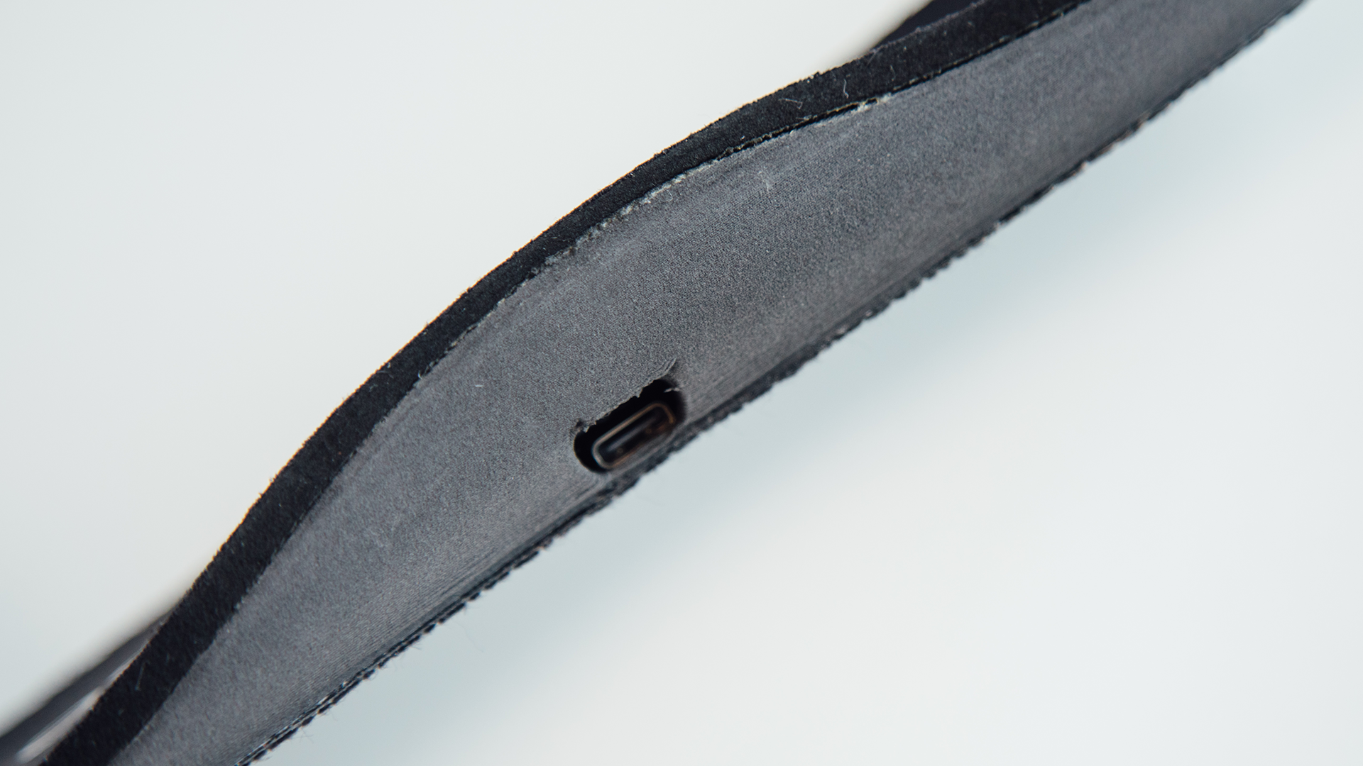 Close-up of the insole showing a charging port. Within the insole are pressure sensors to track foot pressure and an inertial measurement unit sensor to measure changes in motion.<br />