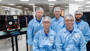Former CDE students Marcus Tay (back row, left) and Kelvin Ng (front row, left) with Prof Low Kay Soon and other students who worked on the Lumelite-4 mission. 