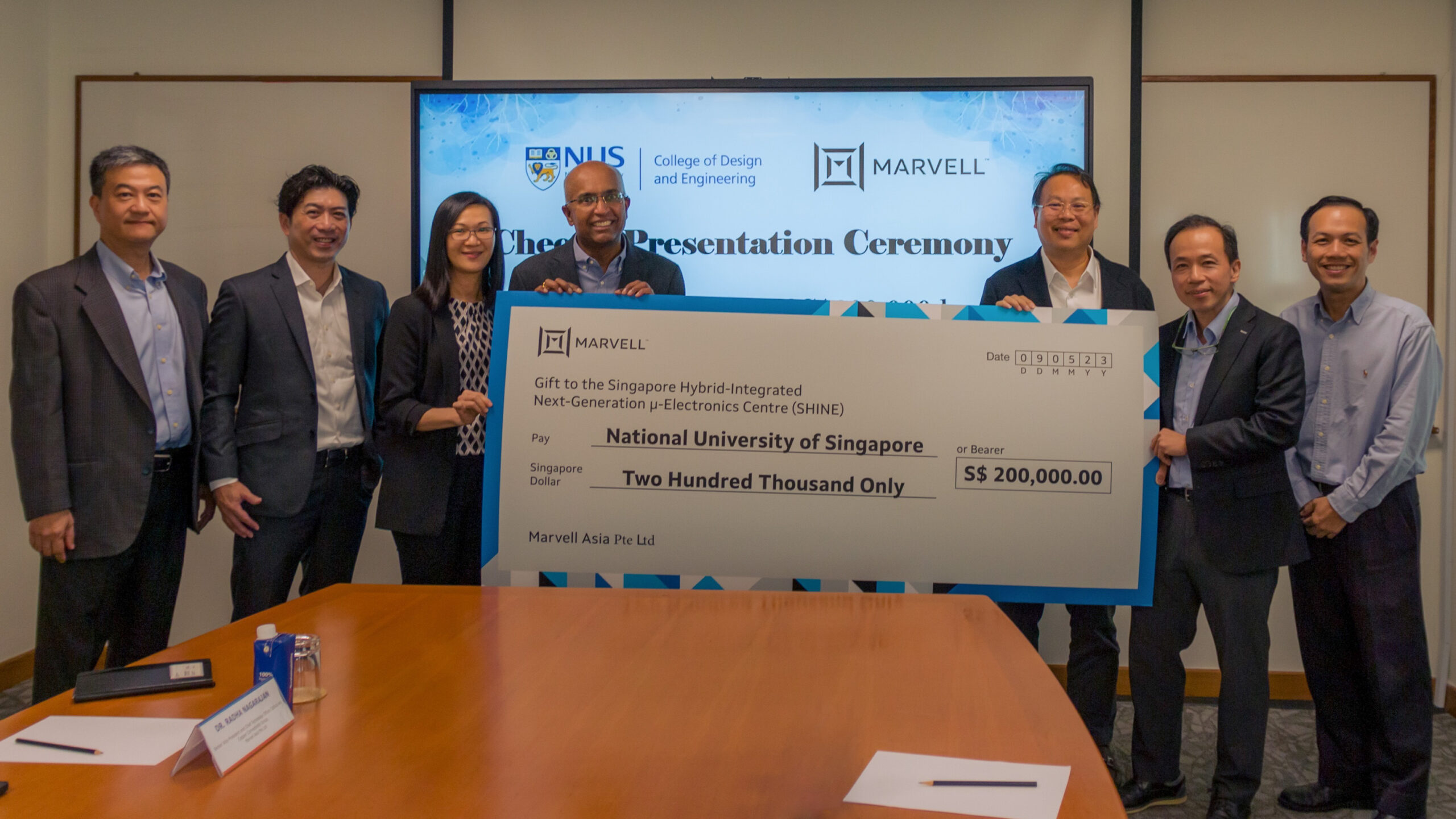 Representatives from Marvell Asia and CDE at the cheque presentation marking the donation.