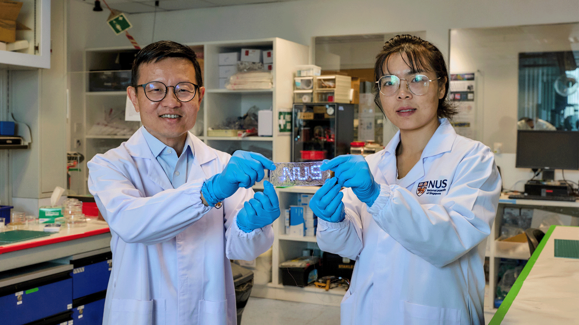 Prof Lim Chwee Teck (left), Dr Chen Shuwen (right) and their team have developed a novel liquid-metal material (held by the researchers) suitable for making flexible and unbreakable circuitry for stretchable electronics.