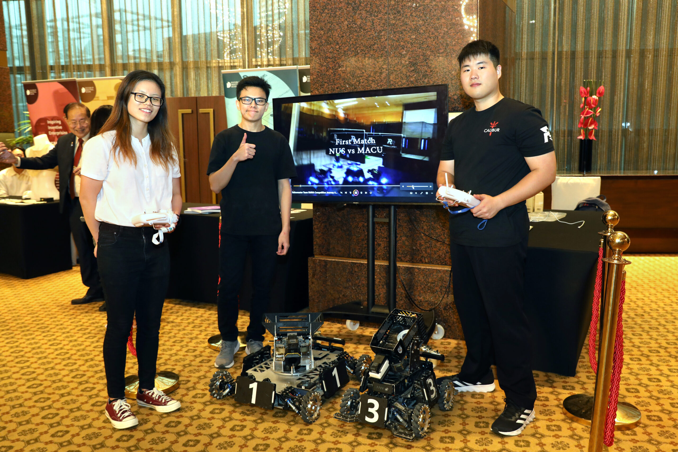RoboMaster Students (from left): Ms Ng De Qi, Mr Lim Yang Sheng, Mr Kim Mongseop