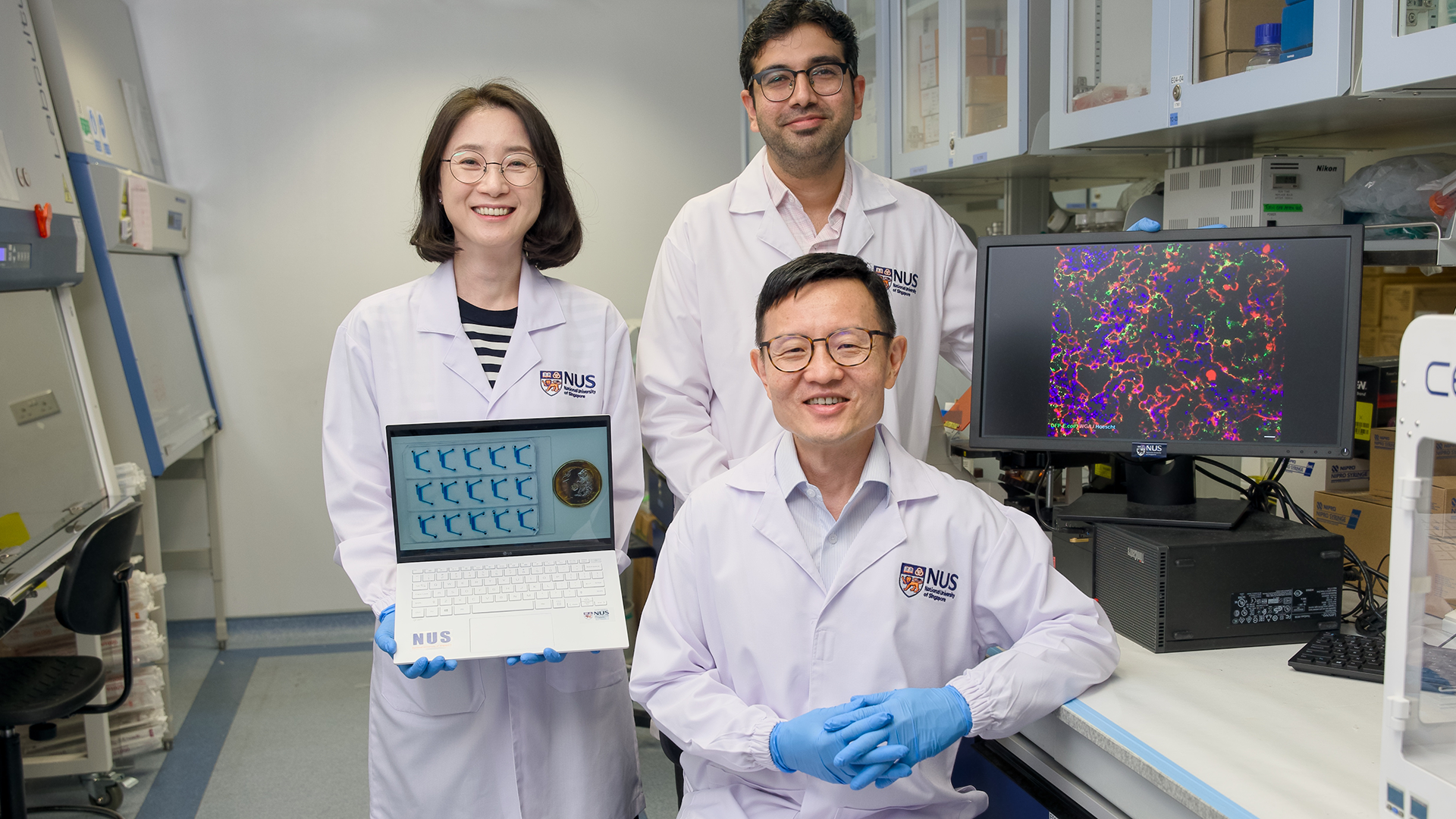 gutonchip1 Professor Lim Chwee Teck (seated) with co-researchers, Senior Research Fellows Dr Lee Jee Yeon (left) and Dr Nishanth Venugopal Menon (right).