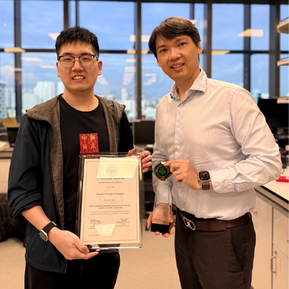 Assoc Prof Benjamin C. K. Tee (right) pictured with a team member