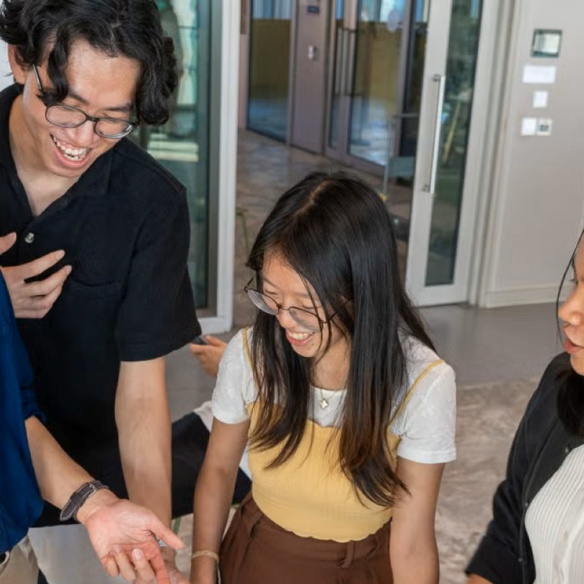 NUS CDE Students at a booth engaging in an activity